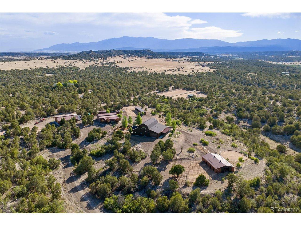 Image 4: The 40-acre estate unfolds across a varied Southern Colorado landscape, with the residence, equestrian facilities and outbuildings positioned throughout the grounds. Image 4: The 40-acre estate unfolds across a varied Southern Colorado landscape, with the residence, equestrian facilities and outbuildings positioned throughout the grounds.