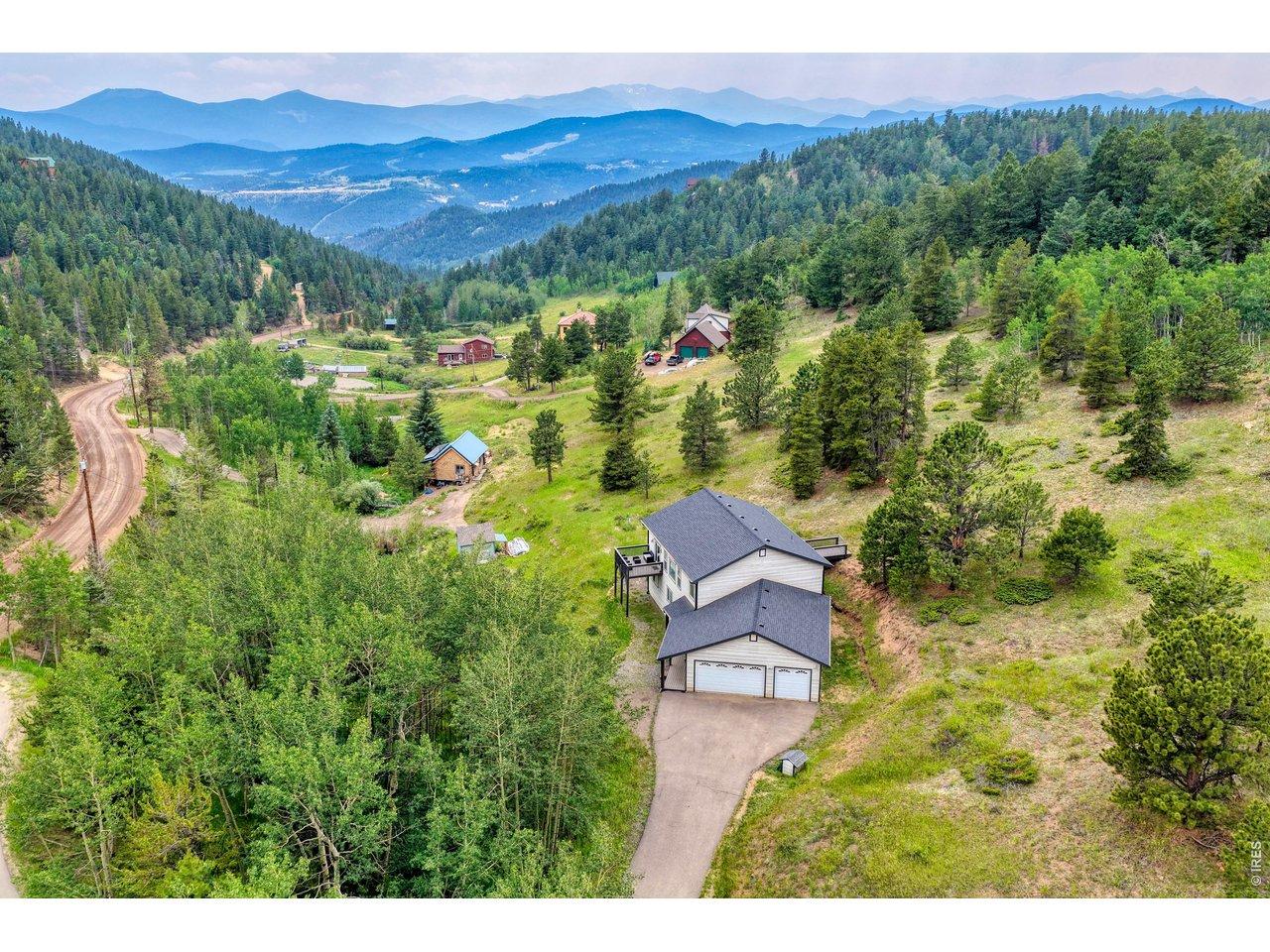 Image 1: Gorgeous views of the Mountains to to the south and west, clear views of Mt Blue Sky. Welcome to 2353 Dory Hill Rd!