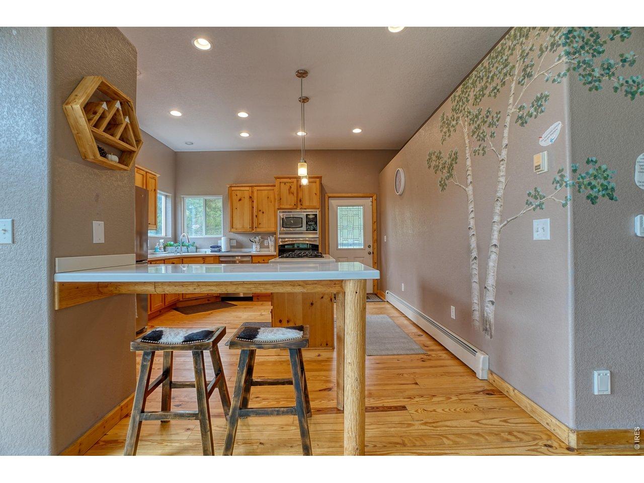 Image 2: Chefs kitchen, excellent natural light. Pine accents + custom pine cabinetry