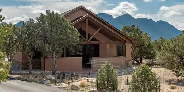 Image 4: West Entrance w/covered patio/fireplace