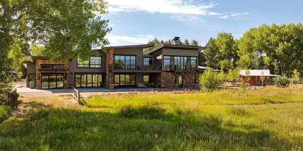 Image 3: Back of New Construction Home with Art Studio in background