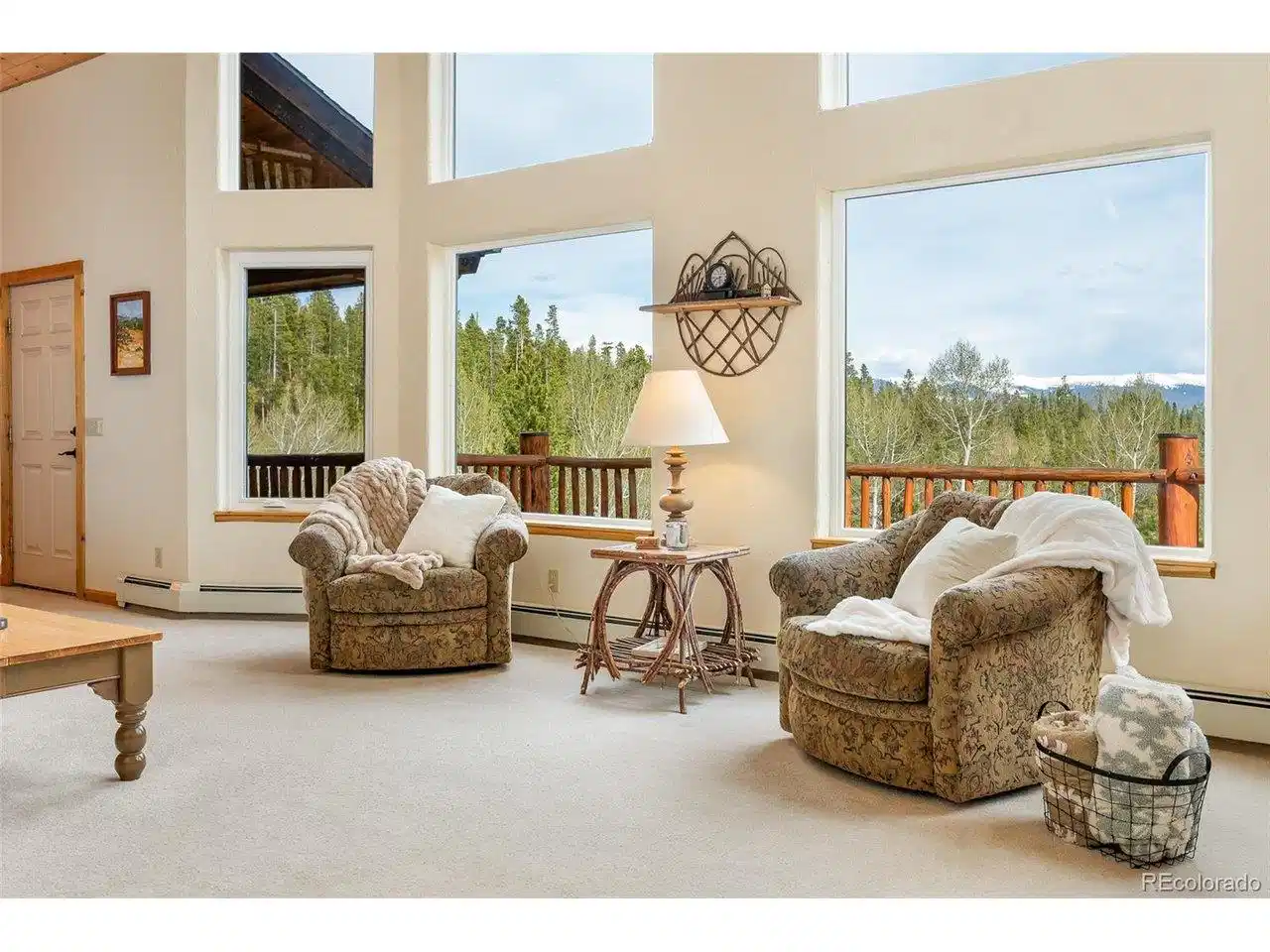 Image 1: Nestled on over three acres of pristine land, this stunning mountain chalet offers an unparalleled retreat.