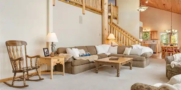 Image 4: As you approach the chalet, breathtaking views of the surrounding mountains greet you at every turn.