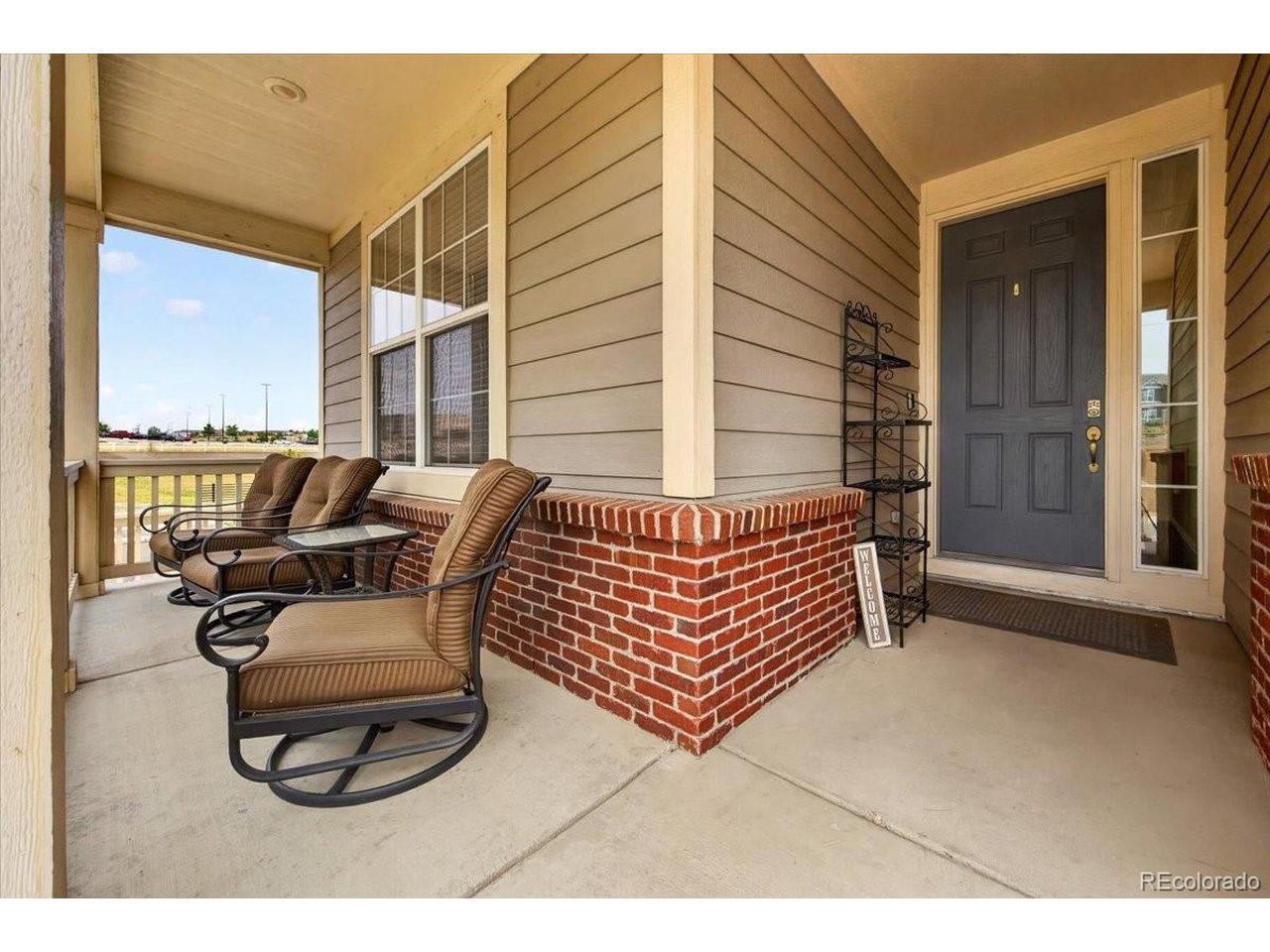 Image 3: Relax with your morning coffee or greet guests from the inviting covered front porch overlooking the beautifully landscaped corner lot. Image 3: Relax with your morning coffee or greet guests from the inviting covered front porch overlooking the beautifully landscaped corner lot.