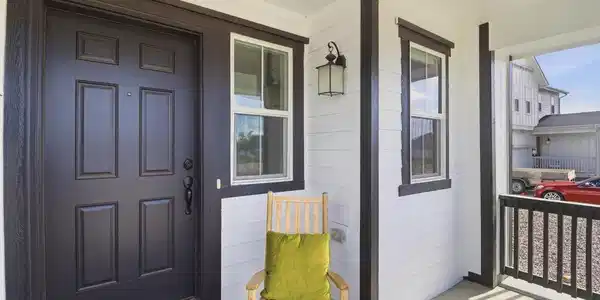 Image 2: The expansive south-facing front porch makes for a perfect place to sip and enjoy your morning coffee