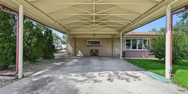 Image 3: Oversized 2-car carport with plenty of space for two SUVs.