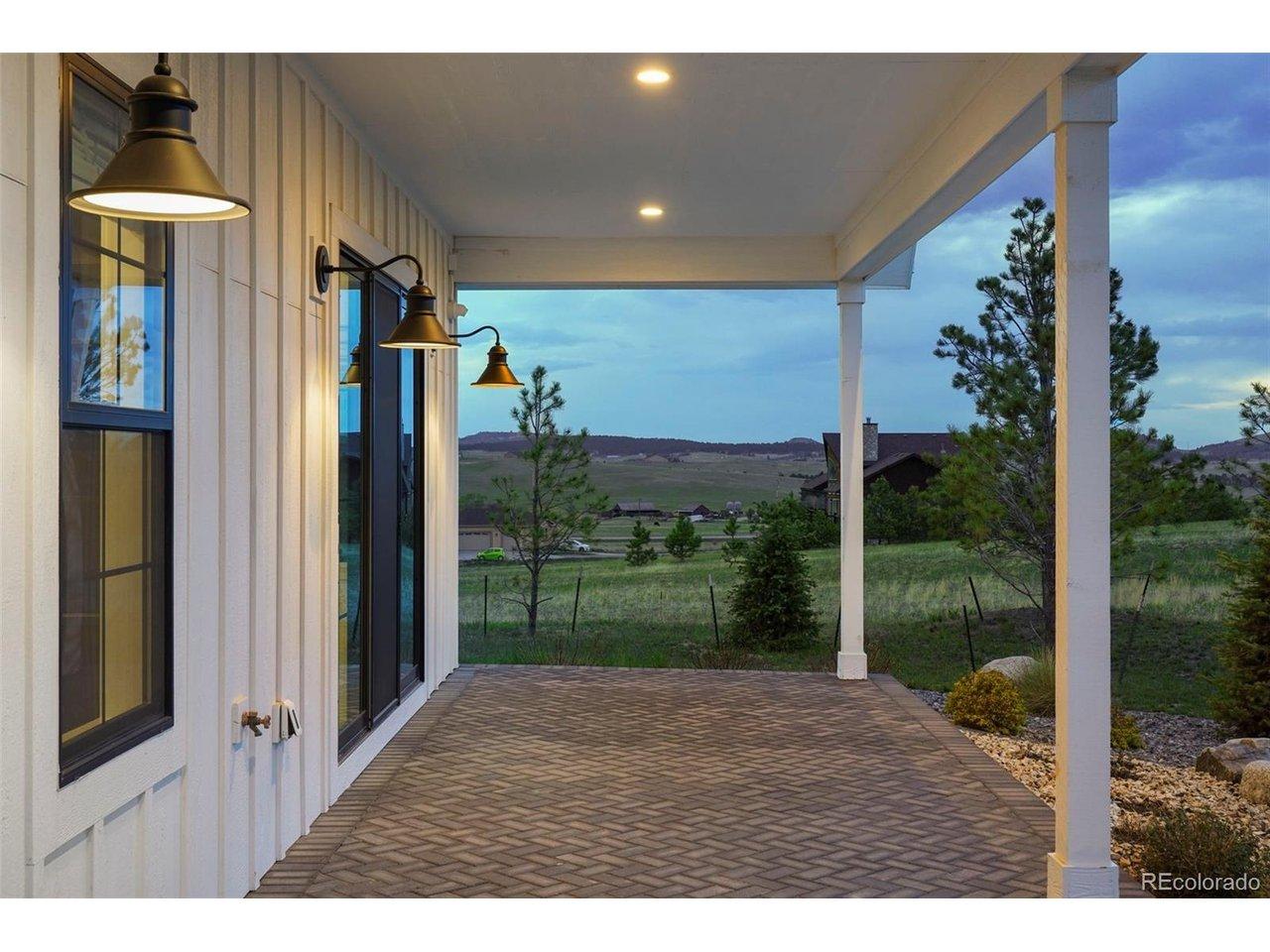 Image 3: Welcoming paver covered patio entrance.