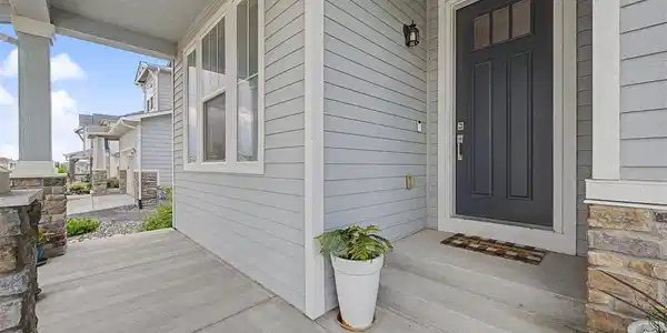 Image 2: The covered front porch welcomes all & provides a place to sit and relax. Image 2: The covered front porch welcomes all & provides a place to sit and relax.