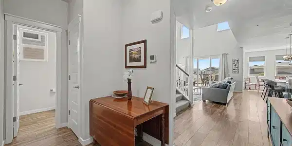 Image 3: Step into the foyer and marvel at the view of the open living area bathed in natural light. Image 3: Step into the foyer and marvel at the view of the open living area bathed in natural light.