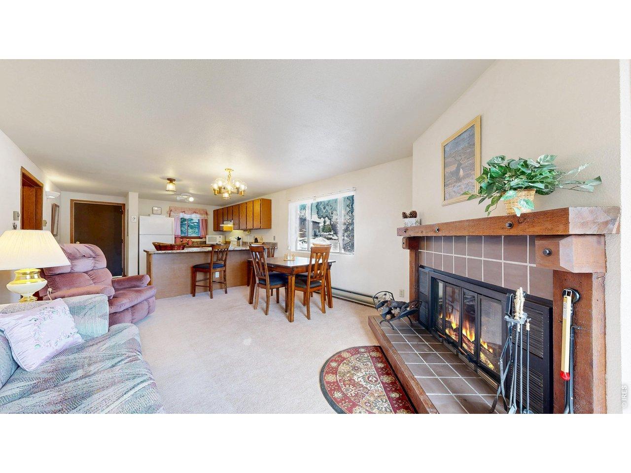 Image 2: Open Concept with Natural Wood-Burning Fireplace
