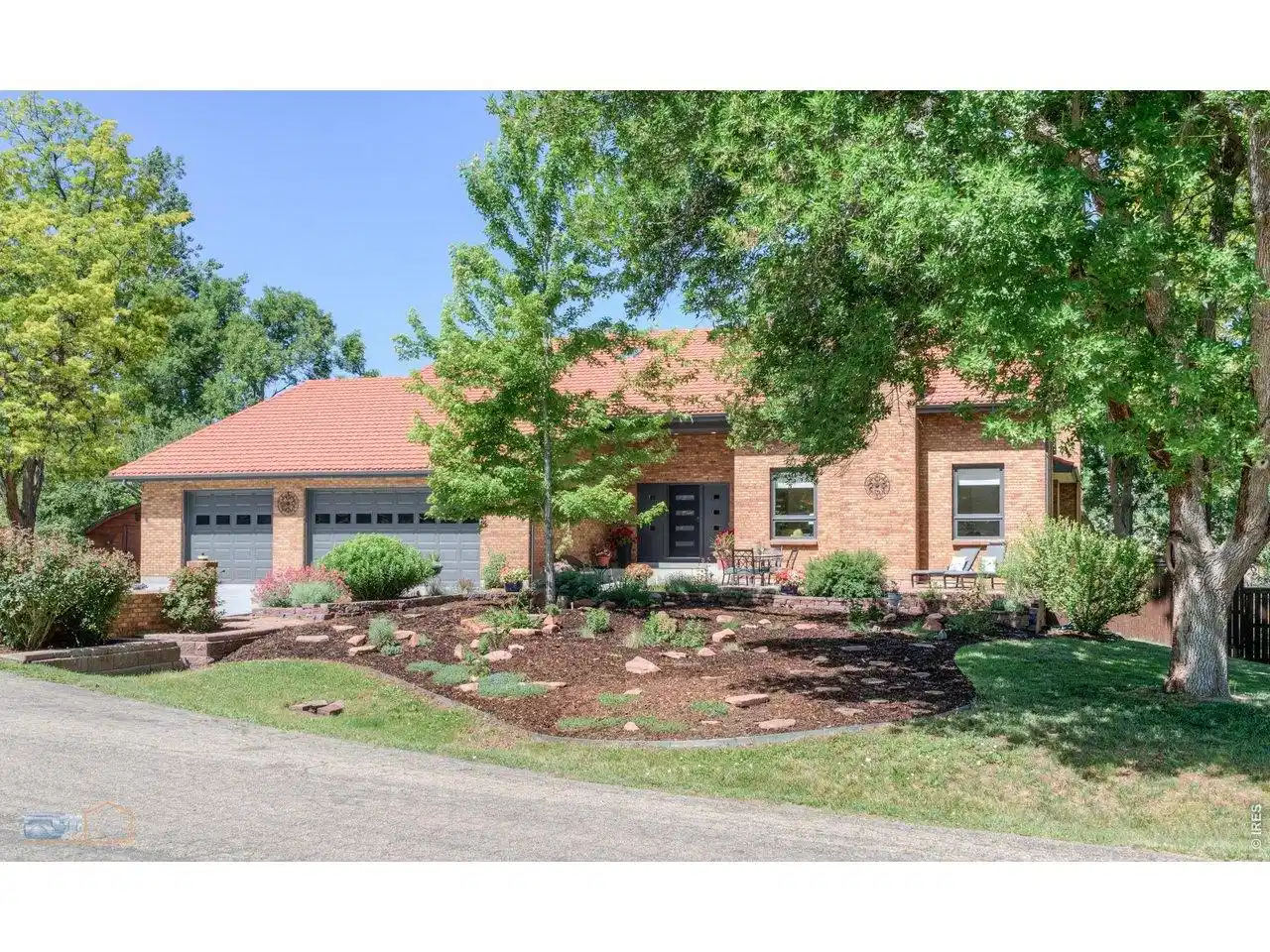 Image 1: Front of home with low water xeriscape garden Image 1: Front of home with low water xeriscape garden