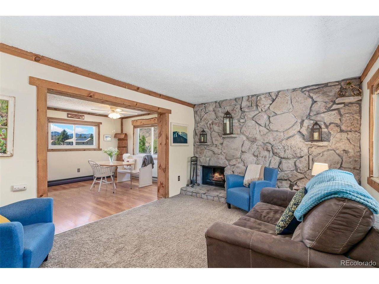 Image 2: Wood Burning Living Room Fireplace with a newly painted rock surround Image 2: Wood Burning Living Room Fireplace with a newly painted rock surround