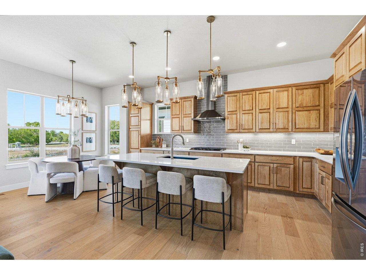 Image 3: Gourmet kitchen featuring quartz countertops, stainless steel appliances, and abundant cabinetry. Image 3: Gourmet kitchen featuring quartz countertops, stainless steel appliances, and abundant cabinetry.
