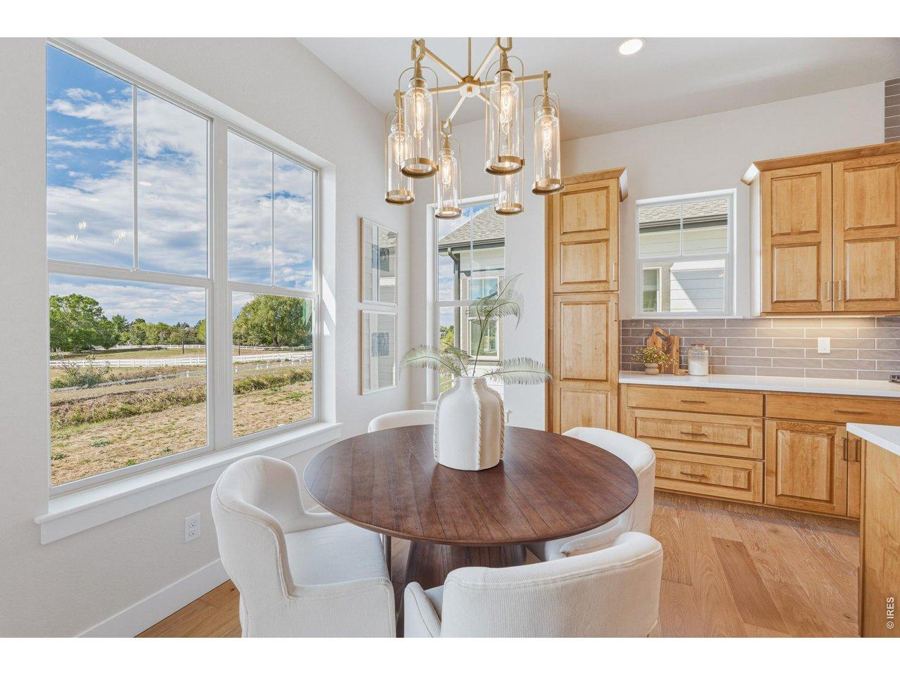 Image 4: Dedicated dining space with natural light and elevated finishes. Image 4: Dedicated dining space with natural light and elevated finishes.