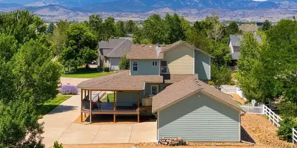 Image 3: Mountain-view curb appeal with expansive driveway, oversized garage, and wraparound porch for relaxing outdoors. Image 3: Mountain-view curb appeal with expansive driveway, oversized garage, and wraparound porch for relaxing outdoors.