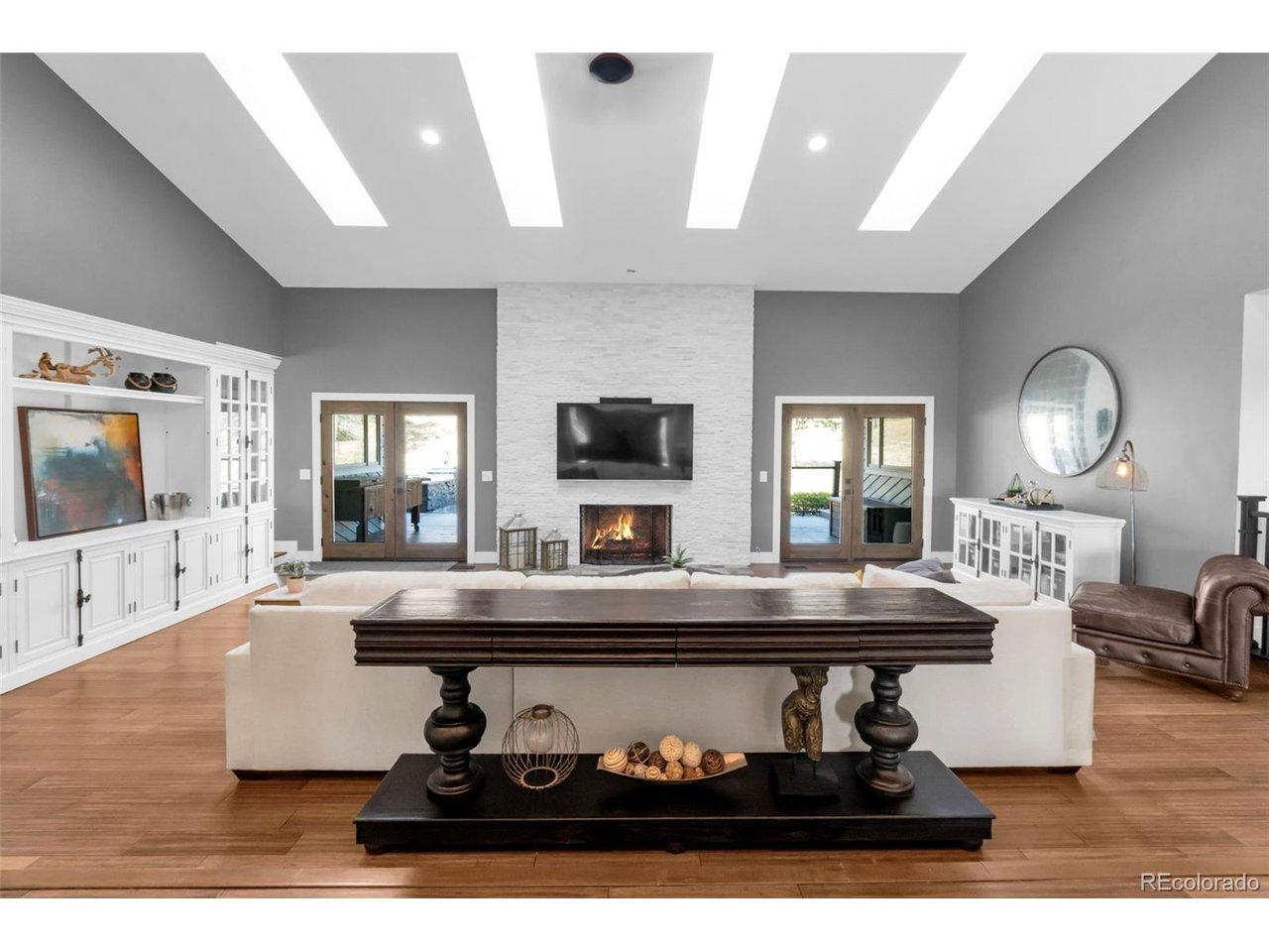 Image 4: Great room with vaulted ceiling, skylights, and gas fireplace Image 4: Great room with vaulted ceiling, skylights, and gas fireplace