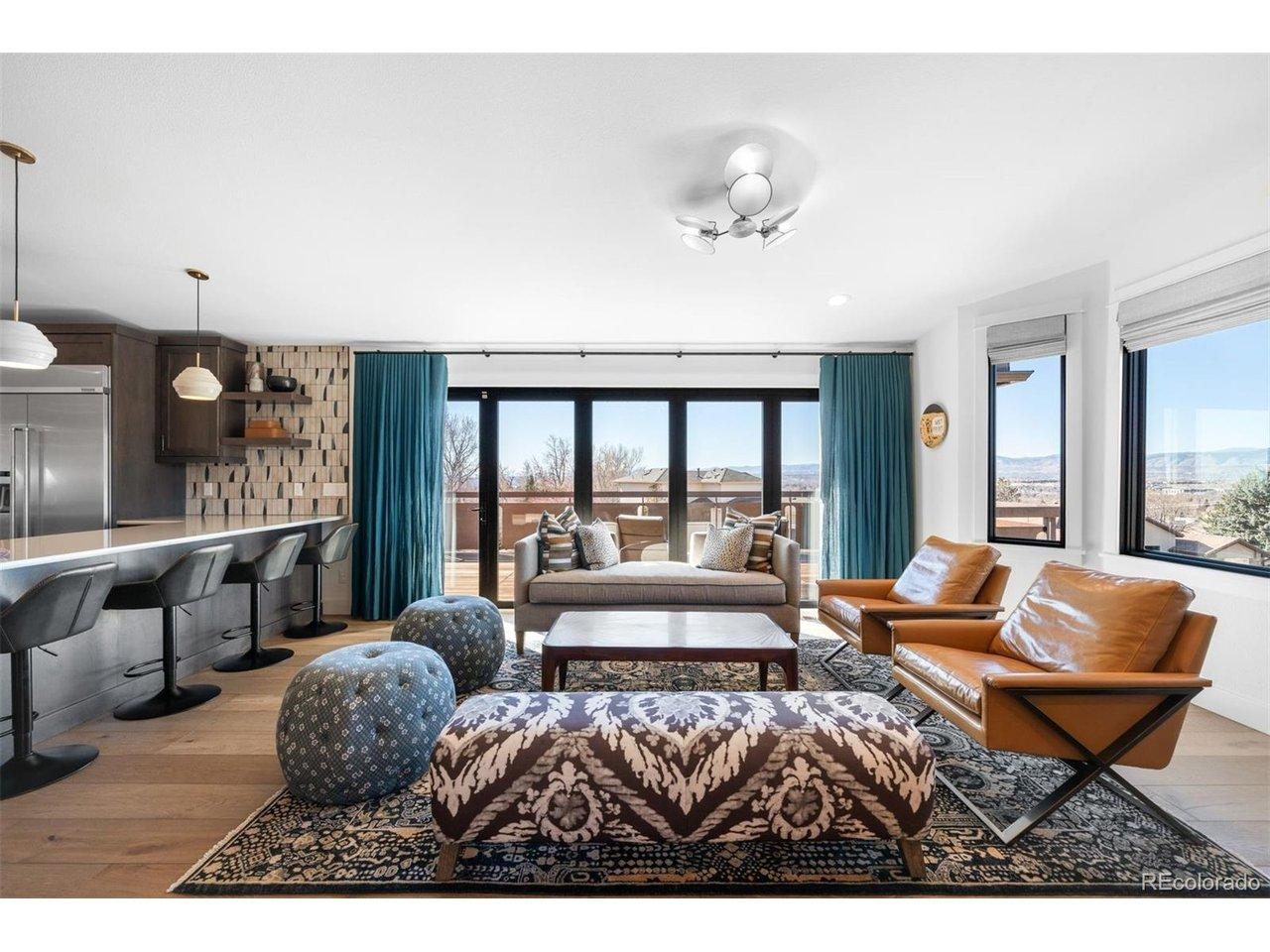 Image 2: Wall of Panoramic windows extend indoor-outdoor living