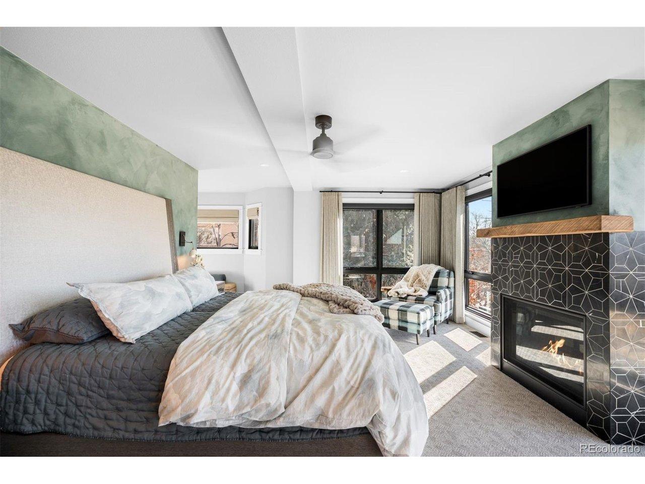 Image 4: Custom-tiled fireplace and seating area adds true retreat feel