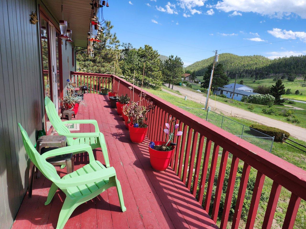 Image 2: Relax and enjoy the many views from the wrap-around deck.