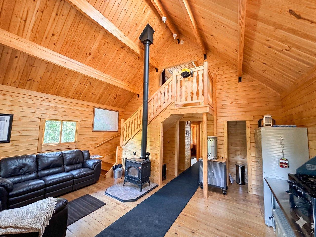 Image 4: The great room invites you in to a fantastic space with vaulted ceilings and useful amenities. AI Enhanced images. Image 4: The great room invites you in to a fantastic space with vaulted ceilings and useful amenities. AI Enhanced images.