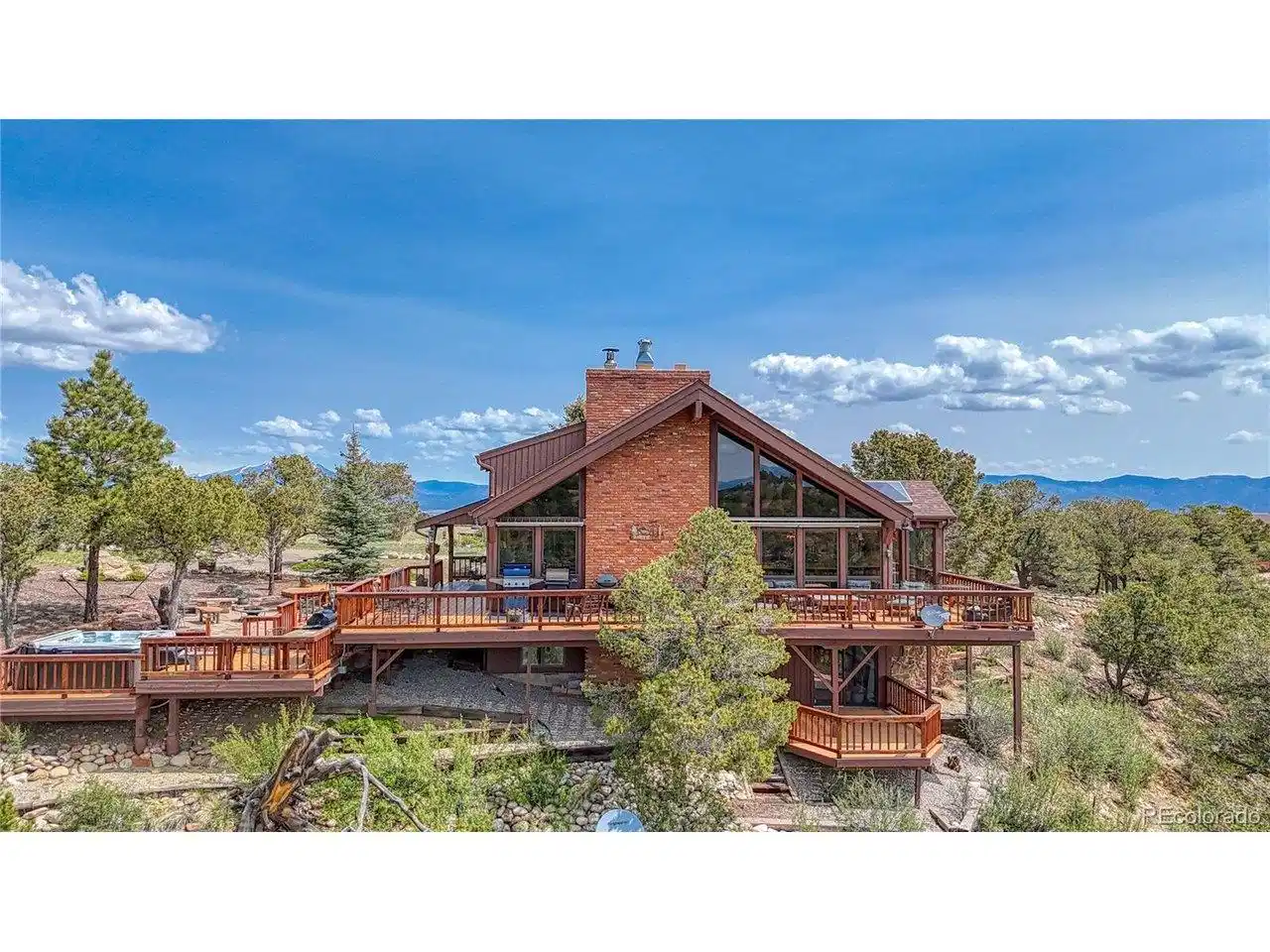 Image 1: Dreaming of mountain living at it's finest? You found it! With a wrap around deck and covered lower deck. The hot tubbing area makes this mountain home perfect for relaxation surrounded by the great outdoors. Image 1: Dreaming of mountain living at it's finest? You found it! With a wrap around deck and covered lower deck. The hot tubbing area makes this mountain home perfect for relaxation surrounded by the great outdoors.