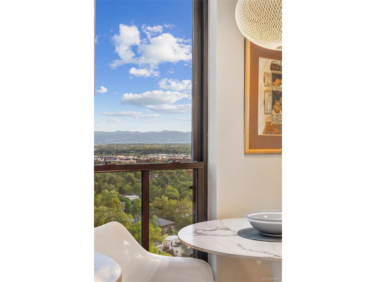 Image 3: Light-filled eat-in nook with mountain views.