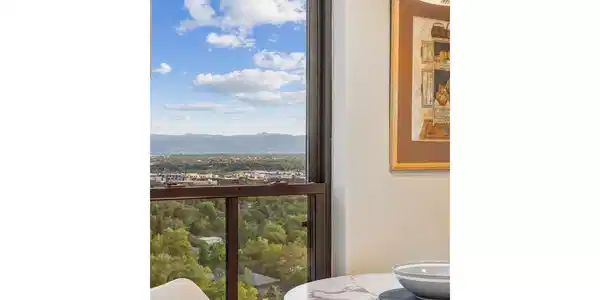 Image 3: Light-filled eat-in nook with mountain views.