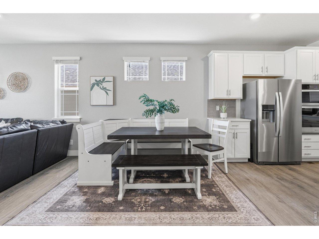 Image 4: The open concept floorpan feeds seamlessly into the dining room. Image 4: The open concept floorpan feeds seamlessly into the dining room.