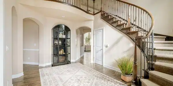 Image 4: A graceful spiral staircase makes a striking first impression and sets the tone for everything beyond. Image 4: A graceful spiral staircase makes a striking first impression and sets the tone for everything beyond.
