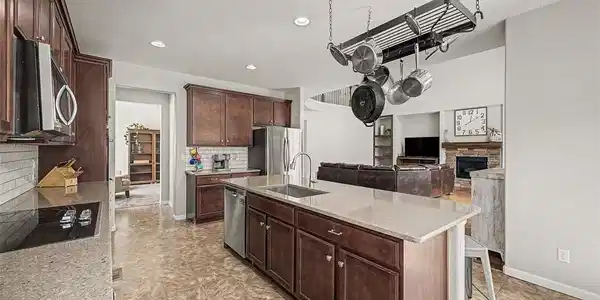 Image 3: Spacious kitchen with oversized island, abundant cabinetry, and open-concept layout Image 3: Spacious kitchen with oversized island, abundant cabinetry, and open-concept layout