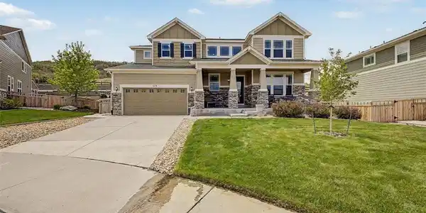 Image 4: Inviting Front Elevation with Expansive Driveway & Covered Porch Image 4: Inviting Front Elevation with Expansive Driveway & Covered Porch