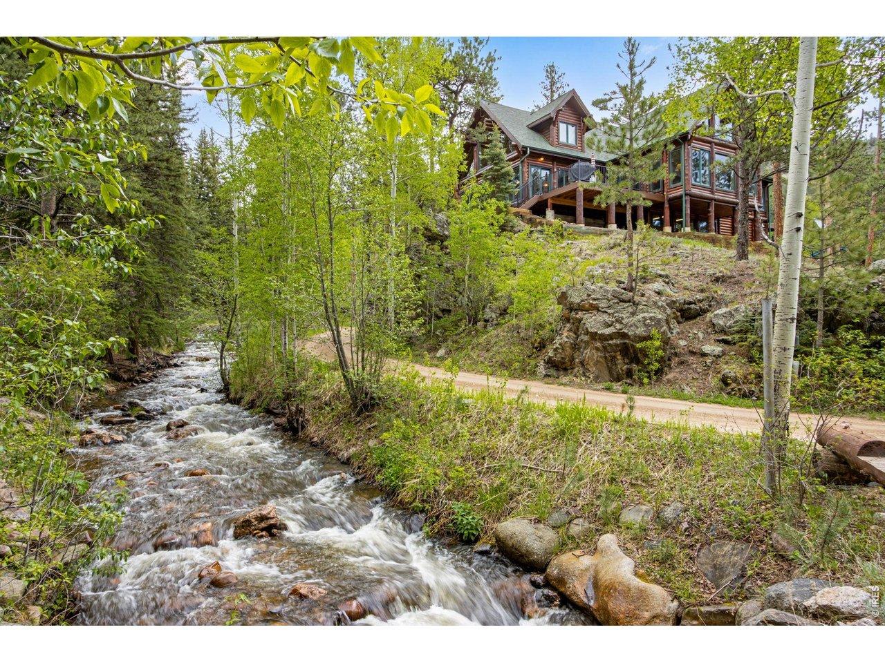Image 1: Welcome to 59 High Point Dr.- Idyllic log home in the heart of Glen Haven! Image 1: Welcome to 59 High Point Dr.- Idyllic log home in the heart of Glen Haven!