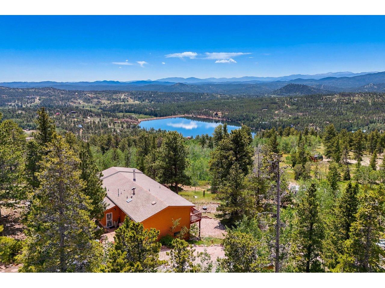 Image 2: expansive views of snowcapped mountains and lake Image 2: expansive views of snowcapped mountains and lake