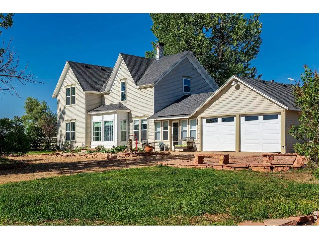 Image 1: Side of home with 2-car garage Image 1: Side of home with 2-car garage