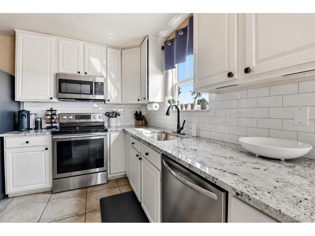 Image 3: Stainless steel appliances and abundant prep space.