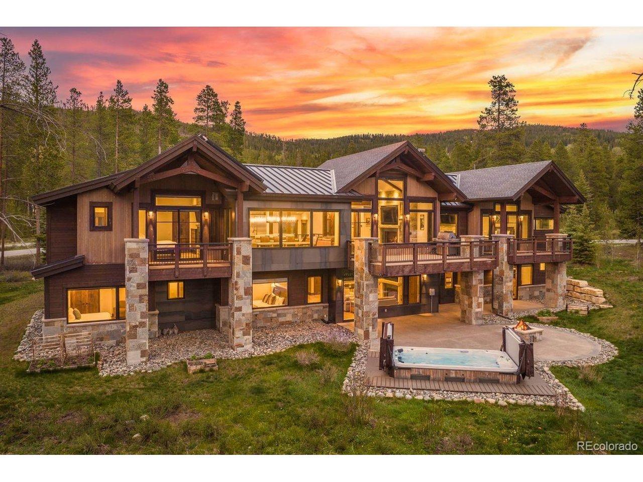 Image 4: Expansive outdoor living spaces featuring a 10-14 person hot tub/plunge pool, fire pit gathering area, walkout patio, and multiple decks-all set within a private mountain setting designed for year-round enjoyment. Image 4: Expansive outdoor living spaces featuring a 10-14 person hot tub/plunge pool, fire pit gathering area, walkout patio, and multiple decks-all set within a private mountain setting designed for year-round enjoyment.