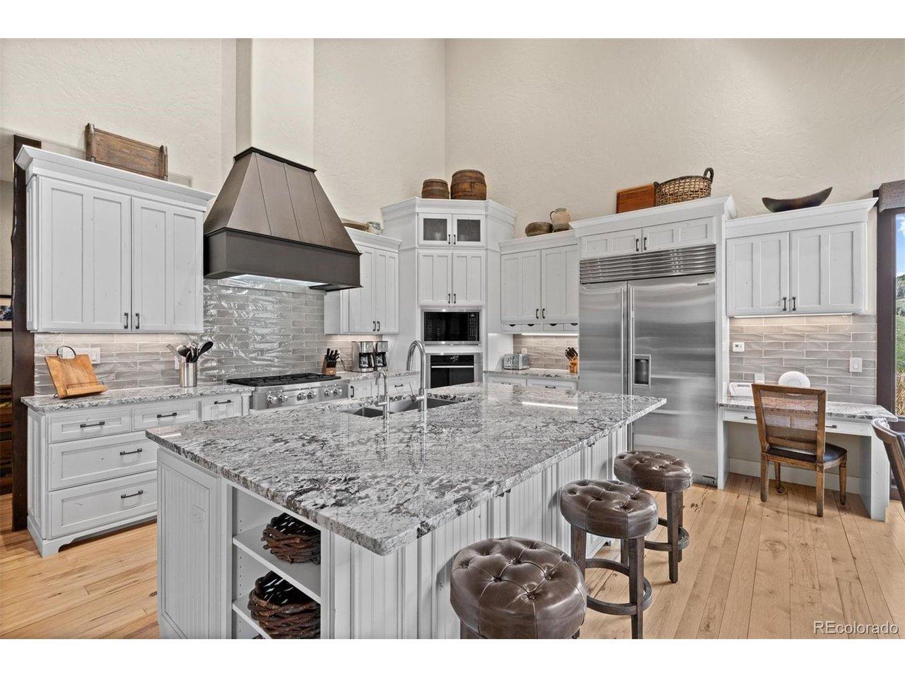 Image 2: Kitchen with custom alder cabinets.