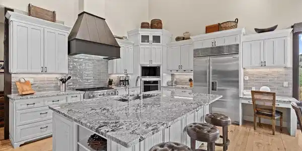 Image 2: Kitchen with custom alder cabinets.