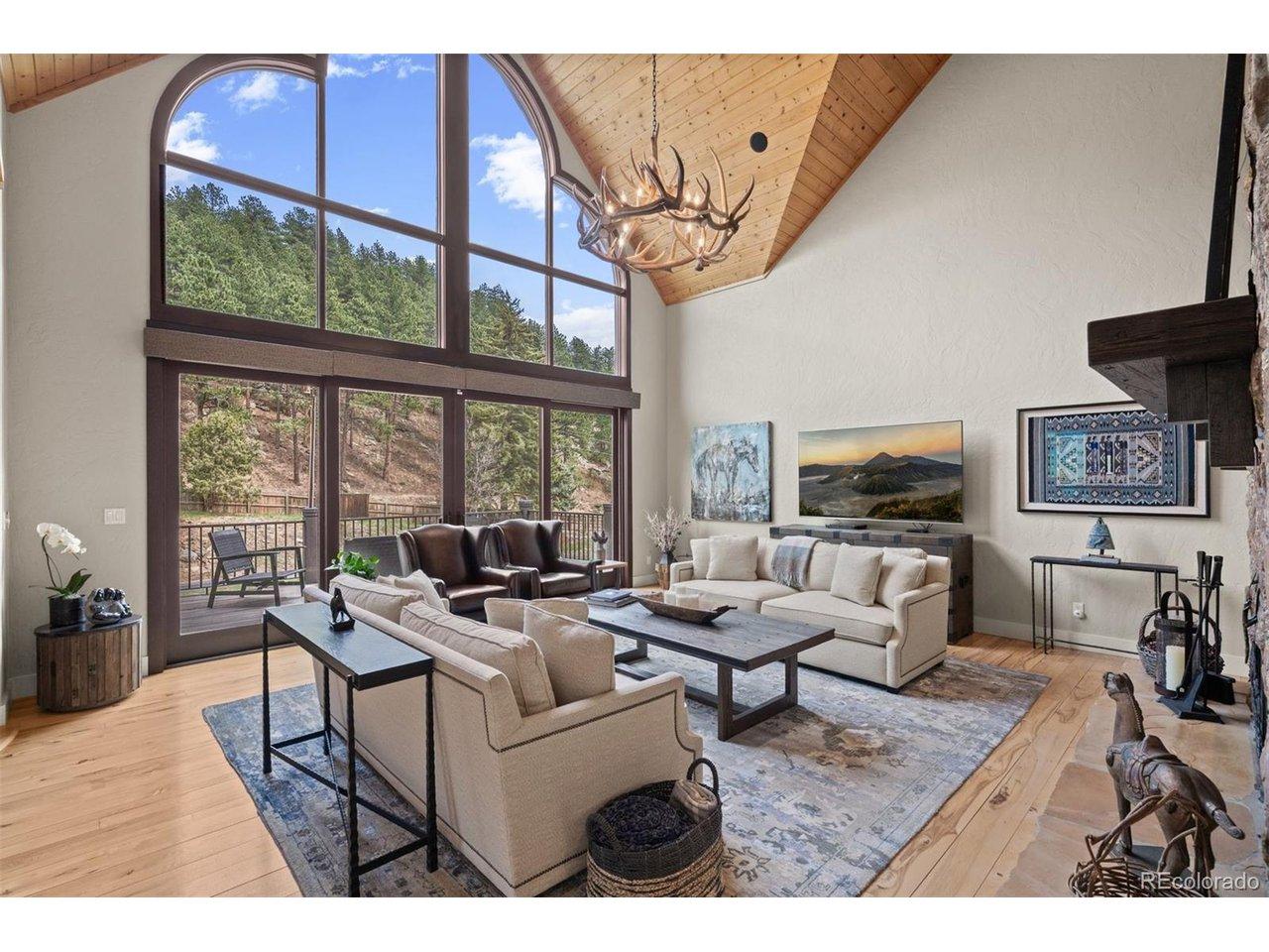 Image 4: Great room.  Gas fireplace. Large sliding doors walk out to front deck
