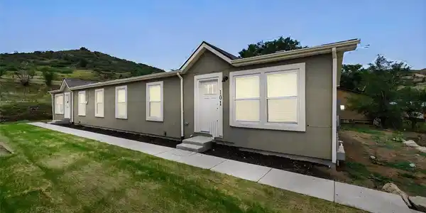 Image 2: Alternate exterior view highlighting the clean architectural lines, multiple windows, private entrances, and surrounding foothill setting. Image 2: Alternate exterior view highlighting the clean architectural lines, multiple windows, private entrances, and surrounding foothill setting.
