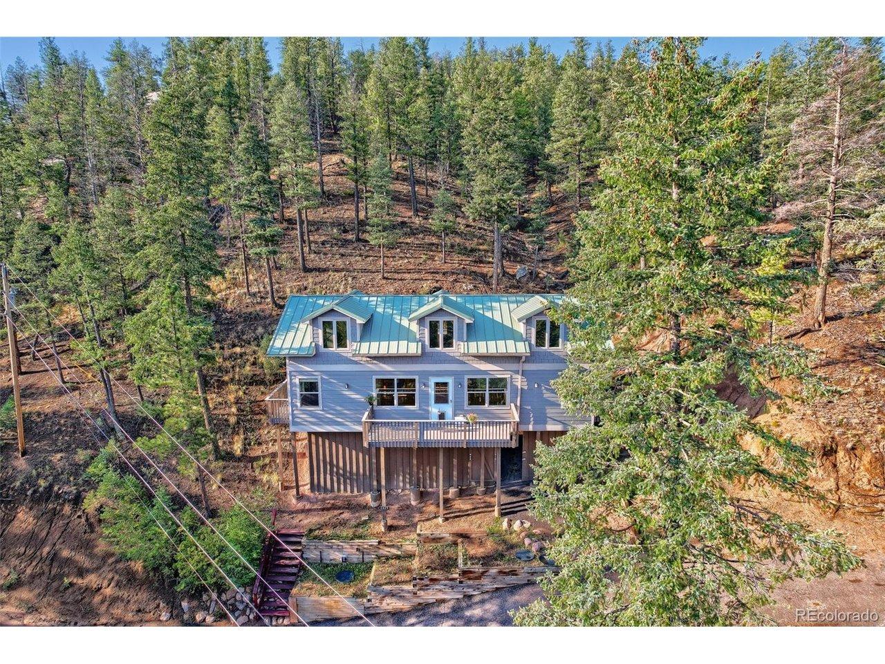 Image 2: Beautifully nestled among towering pines, this inviting mountain retreat offers privacy, multiple decks, and year-round Colorado living. Image 2: Beautifully nestled among towering pines, this inviting mountain retreat offers privacy, multiple decks, and year-round Colorado living.