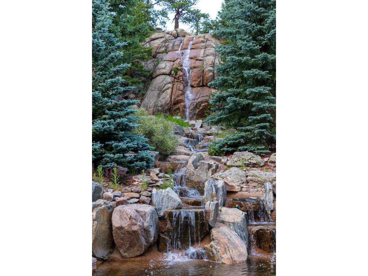 Image 4: Look at this massive waterfall, (after which the estate is named) visible from the back patio. This water cascades 30 feet, reinforcing the serenity that can only be found in the wild. Image 4: Look at this massive waterfall, (after which the estate is named) visible from the back patio. This water cascades 30 feet, reinforcing the serenity that can only be found in the wild.