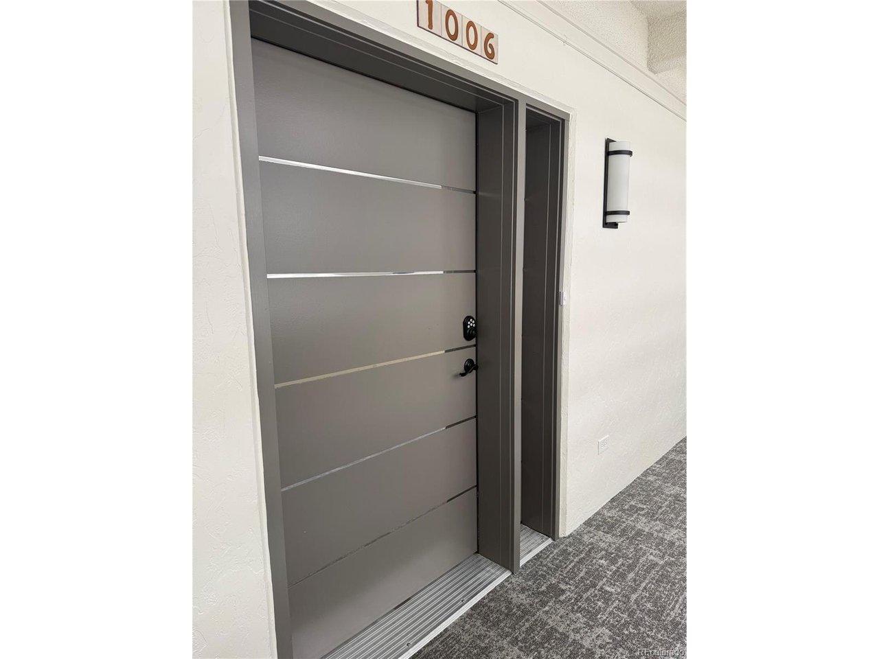 Image 2: Wide and modern front door Unit 1006.
