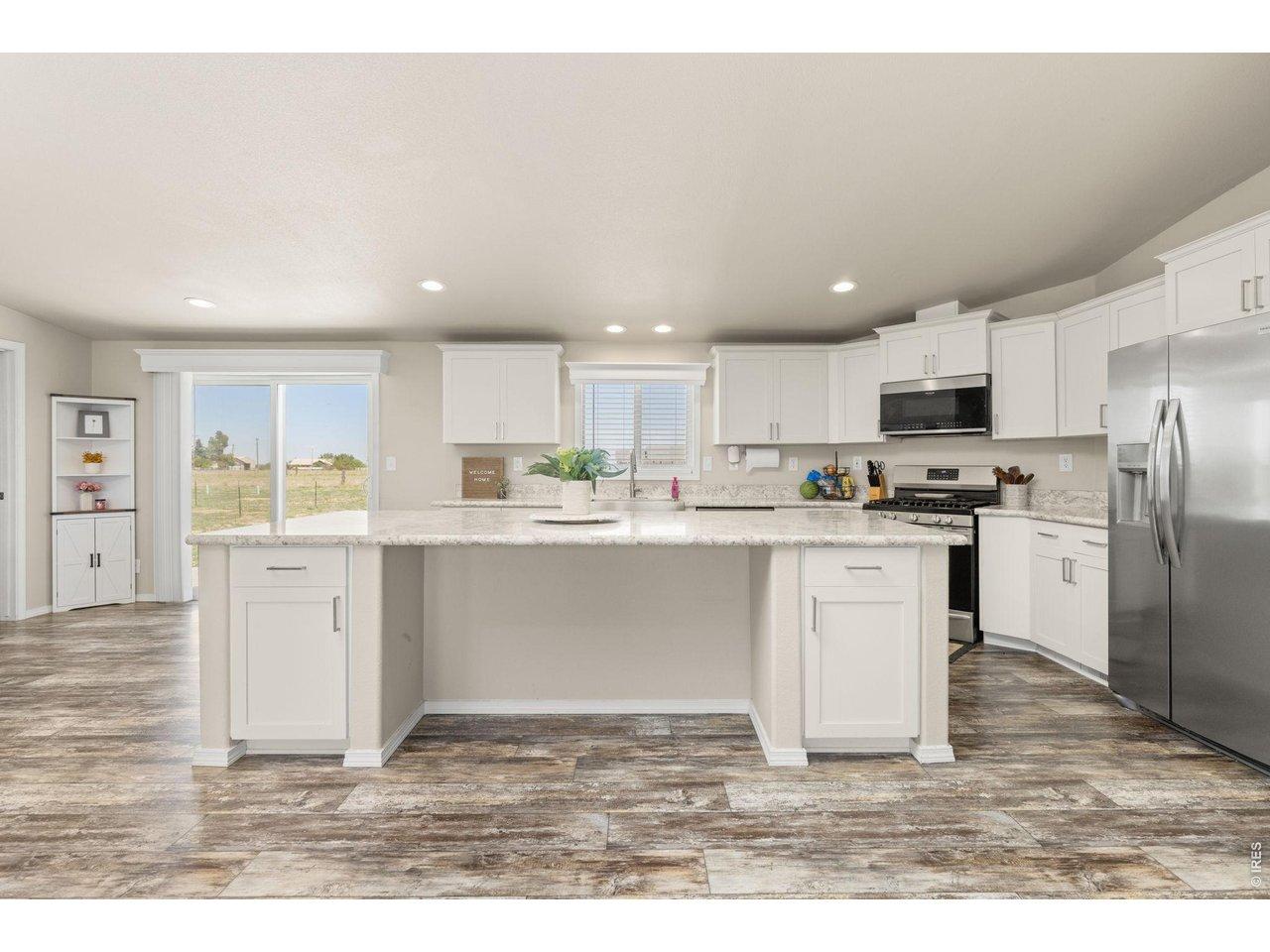 Image 4: Quartz-Style Island Designed for Upscale Entertaining and Seamless Meal Prep Image 4: Quartz-Style Island Designed for Upscale Entertaining and Seamless Meal Prep