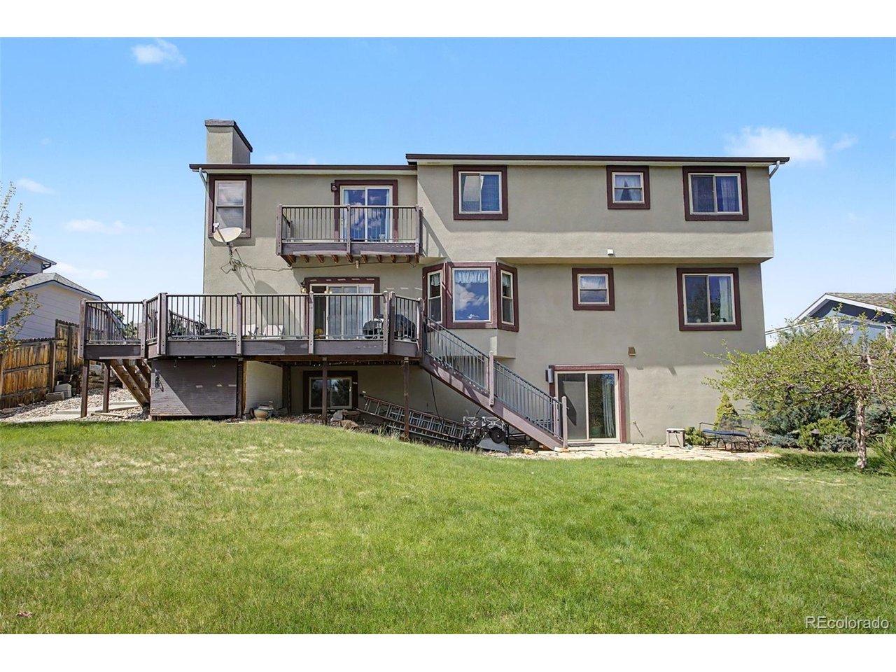 Image 4: Back of home- note the upper AND lower decks. Image 4: Back of home- note the upper AND lower decks.