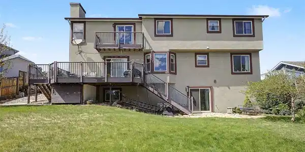 Image 4: Back of home- note the upper AND lower decks. Image 4: Back of home- note the upper AND lower decks.