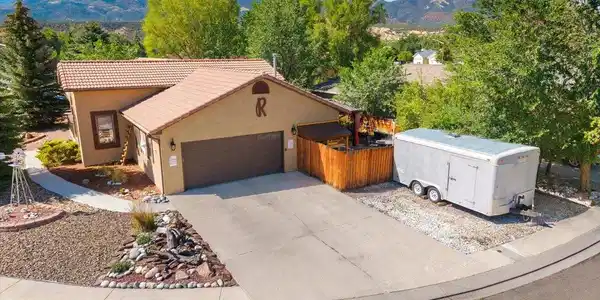 Image 3: Attached oversized 2 car garage and extra off-street parking
