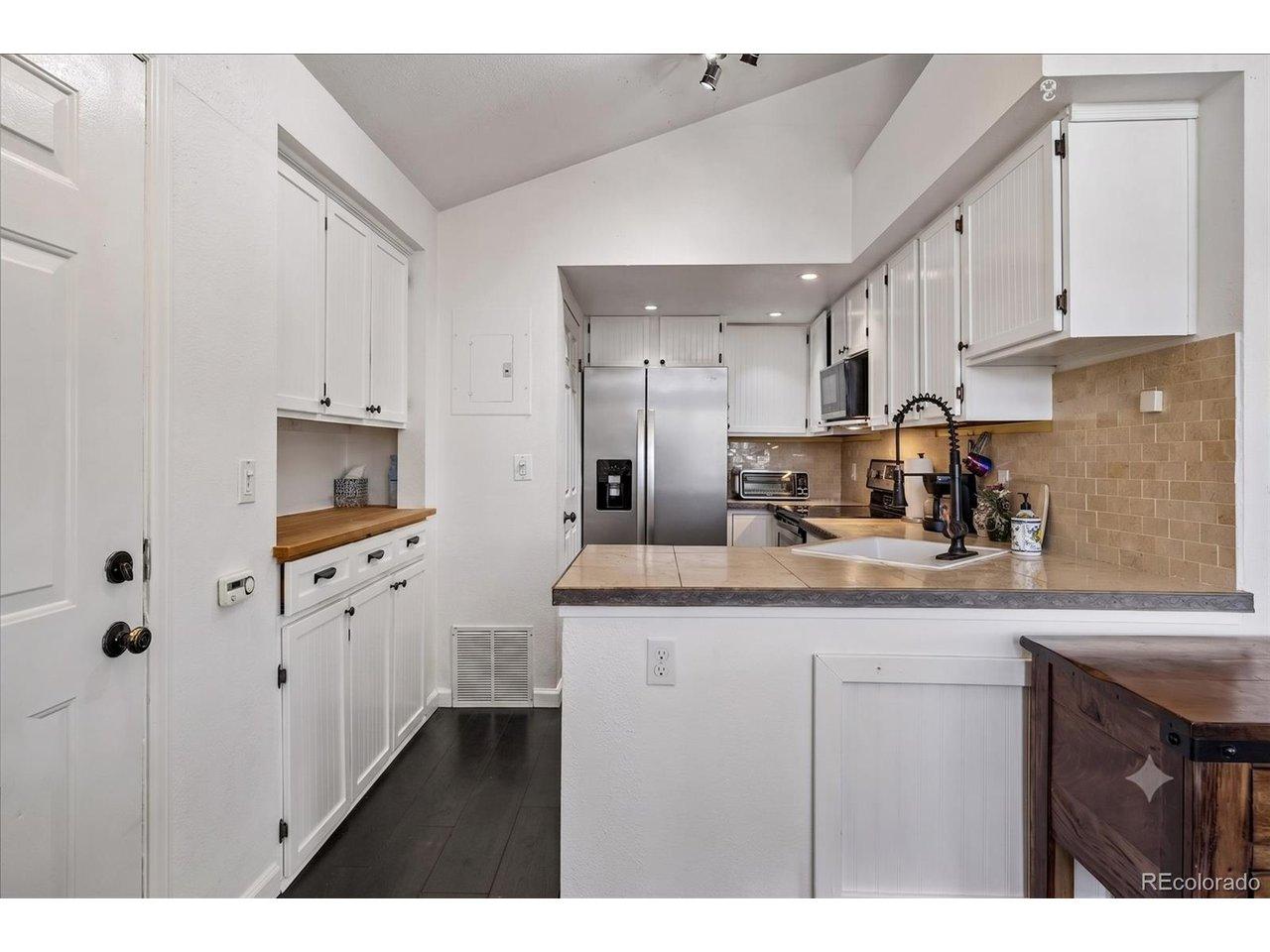 Image 2: Tile backsplash, tile countertops, new appliances Image 2: Tile backsplash, tile countertops, new appliances