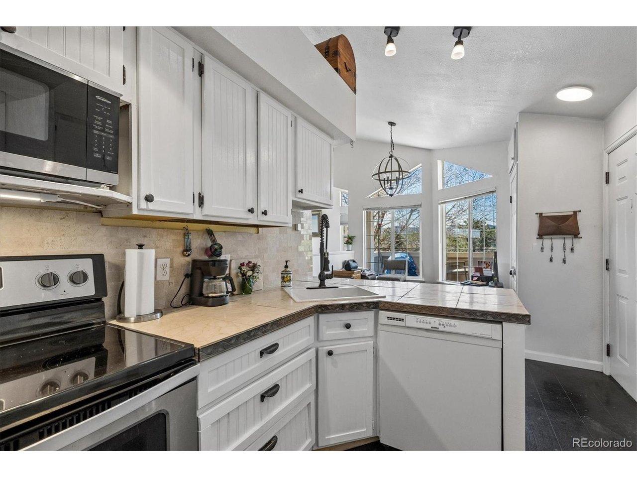 Image 4: Dishwasher was replaced with stainless steel one after photos were taken Image 4: Dishwasher was replaced with stainless steel one after photos were taken