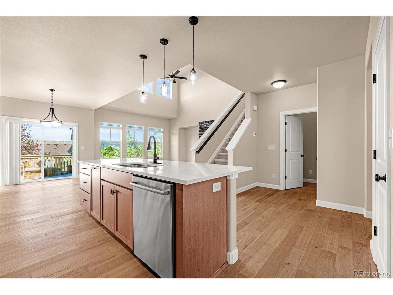Image 3: View of the Kitchen open to the Great Room and walk-out dining area. Image 3: View of the Kitchen open to the Great Room and walk-out dining area.